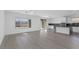 Open concept living room featuring hardwood floors and a modern kitchen at 12453 Foxtail Run Ave, Las Vegas, NV 89138