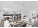 Open concept living room with hardwood floors, modern design, and stainless steel appliances at 12453 Foxtail Run Ave, Las Vegas, NV 89138