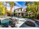 Spacious backyard with a refreshing pool, covered patio, and well-manicured lawn at 1301 Kingdom St, Las Vegas, NV 89117