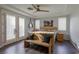 Bedroom with wood floors, a ceiling fan, and French doors allows a bright and comfortable private retreat at 1301 Kingdom St, Las Vegas, NV 89117