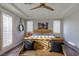 Inviting bedroom with hardwood floors, white shutters and a wooden bench offers a tranquil personal space at 1301 Kingdom St, Las Vegas, NV 89117