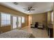 Spacious suite with ceiling fan, tile flooring, kitchenette, and access to the outdoors at 1301 Kingdom St, Las Vegas, NV 89117