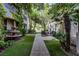Beautiful courtyard with lush landscaping, stone fountain, seating, and walkway at 1301 Kingdom St, Las Vegas, NV 89117