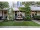 Charming courtyard with a stone fountain surrounded by lush greenery and vibrant plants at 1301 Kingdom St, Las Vegas, NV 89117