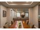 Open-concept dining room with a large table, fireplace, and view to the living area at 1301 Kingdom St, Las Vegas, NV 89117