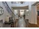 Beautiful foyer with hardwood floors, a grand staircase, and an open floor plan at 1301 Kingdom St, Las Vegas, NV 89117