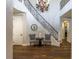 Stately foyer featuring a staircase with iron railing, and hardwood floors at 1301 Kingdom St, Las Vegas, NV 89117