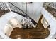 Elegant foyer with hardwood floors, curved staircase, and ornate chandelier at 1301 Kingdom St, Las Vegas, NV 89117