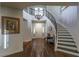 Elegant foyer with hardwood floors, a grand staircase, and a chandelier at 1301 Kingdom St, Las Vegas, NV 89117