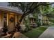 Inviting front entry with a decorative door, lush landscaping, and a charming fountain at 1301 Kingdom St, Las Vegas, NV 89117