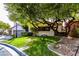 Charming home featuring mature trees providing plenty of shade on a well manicured lawn at 1301 Kingdom St, Las Vegas, NV 89117