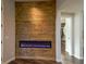 Hallway with electric fireplace and access to the walk-in closet at 1301 Kingdom St, Las Vegas, NV 89117