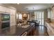 Elegant kitchen with granite island, stainless steel appliances, and seamless flow to the living area at 1301 Kingdom St, Las Vegas, NV 89117