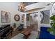 Bright living room featuring a piano, a blue sofa, and hardwood floors at 1301 Kingdom St, Las Vegas, NV 89117