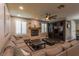 Comfortable living room features a cozy fireplace, media center, and natural light from shuttered windows at 1301 Kingdom St, Las Vegas, NV 89117