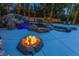 Stunning pool featuring a rock waterfall, slide, and fire pit, creating a luxurious backyard oasis at 1301 Kingdom St, Las Vegas, NV 89117