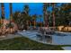 Gorgeous pool area with lush landscaping, a waterfall feature, and comfortable lounge chairs for relaxation at 1301 Kingdom St, Las Vegas, NV 89117