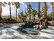 Beautiful pool with slide and rock waterfall surrounded by palm trees and manicured landscaping at 1301 Kingdom St, Las Vegas, NV 89117
