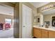 Bathroom featuring double sinks and view into a bedroom at 2265 Stone Breeze Ave, North Las Vegas, NV 89031
