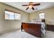 Bedroom featuring a wooden sleigh bed, neutral walls, and a ceiling fan at 2265 Stone Breeze Ave, North Las Vegas, NV 89031