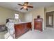 Bedroom featuring a sleigh bed, side table, and dresser with access to the hallway at 2265 Stone Breeze Ave, North Las Vegas, NV 89031