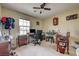 Bedroom with ceiling fan, window, and neutral carpet has a playful yet functional design at 2265 Stone Breeze Ave, North Las Vegas, NV 89031