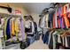 Spacious walk-in closet with organized storage racks and clothing at 2265 Stone Breeze Ave, North Las Vegas, NV 89031