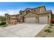 Beautiful two-story home with a three-car garage and extended driveway at 2265 Stone Breeze Ave, North Las Vegas, NV 89031