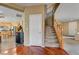 Welcoming foyer featuring hardwood floors and staircase, leading to the kitchen and main living areas at 2265 Stone Breeze Ave, North Las Vegas, NV 89031