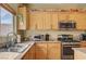 Bright kitchen showcases granite countertops and stainless steel appliances at 2265 Stone Breeze Ave, North Las Vegas, NV 89031