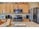 Kitchen island with granite countertops and stainless steel appliances at 2265 Stone Breeze Ave, North Las Vegas, NV 89031