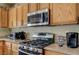 Kitchen features stainless steel appliances and light wood cabinetry at 2265 Stone Breeze Ave, North Las Vegas, NV 89031