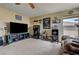 Cozy living room with entertainment center, windows, and comfortable seating at 2265 Stone Breeze Ave, North Las Vegas, NV 89031