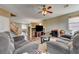 Inviting living room with plush gray sofas and access to dining area at 2265 Stone Breeze Ave, North Las Vegas, NV 89031
