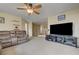 Spacious living room with large entertainment center and ample seating at 2265 Stone Breeze Ave, North Las Vegas, NV 89031