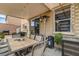 Covered patio featuring a dining area with a barbecue, heater, and low-maintenance desert landscaping at 2265 Stone Breeze Ave, North Las Vegas, NV 89031