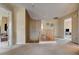 Open upstairs landing with neutral carpet and wooden railing at 2265 Stone Breeze Ave, North Las Vegas, NV 89031