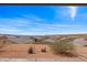 Large backyard featuring desert landscaping providing stunning views of the surrounding community and mountains at 260 Haley Way # 157, Mesquite, NV 89027