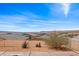 Backyard showcasing a gravel yard, low-maintenance desert landscaping, and expansive neighborhood views at 260 Haley Way # 157, Mesquite, NV 89027