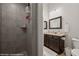 Bathroom featuring grey tiled shower and vanity at 260 Haley Way # 157, Mesquite, NV 89027