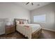 Bedroom with ceiling fan, large window, and a wooden bed frame at 260 Haley Way # 157, Mesquite, NV 89027