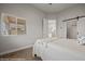 Bedroom with large window, sliding door to bathroom, and soft natural light at 260 Haley Way # 157, Mesquite, NV 89027