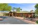 Community clubhouse featuring a covered entrance, lush landscaping, and welcoming ambiance at 260 Haley Way # 157, Mesquite, NV 89027