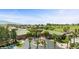 Beautiful community featuring lush landscaping, a well-manicured golf course, and stunning mountain views in the distance at 260 Haley Way # 157, Mesquite, NV 89027