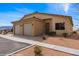 Charming single-story home featuring a two-car garage and low-maintenance desert landscaping in a sunny setting at 260 Haley Way # 157, Mesquite, NV 89027