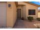 Inviting front entrance featuring a stylish front door, low maintenance landscaping, and neutral color palette at 260 Haley Way # 157, Mesquite, NV 89027