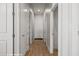 Bright hallway featuring white doors, wood floors, and recessed lighting creates a welcoming entrance into the home at 260 Haley Way # 157, Mesquite, NV 89027