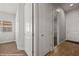Hallway features a bedroom with natural light, doors, and wood floors, that enhance the home's functionality at 260 Haley Way # 157, Mesquite, NV 89027