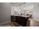 Open concept kitchen featuring wood floors, granite countertops and stainless steel dishwasher at 260 Haley Way # 157, Mesquite, NV 89027