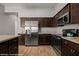 Kitchen with stainless appliances, dark cabinets and light countertops at 260 Haley Way # 157, Mesquite, NV 89027